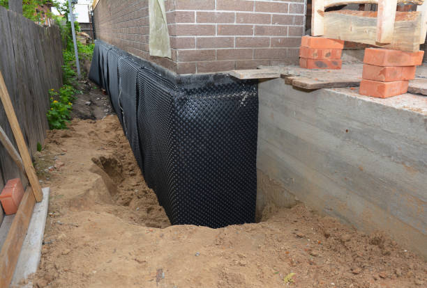 Happy homeowners after waterproofing job in Centreville